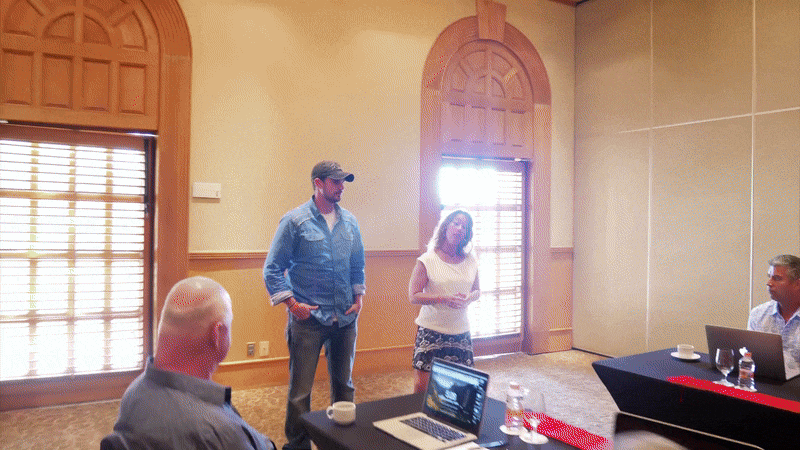 Justin and Brenda Glover speaking on stage